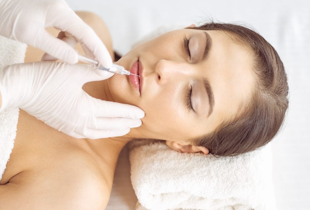 woman getting botox and filler
